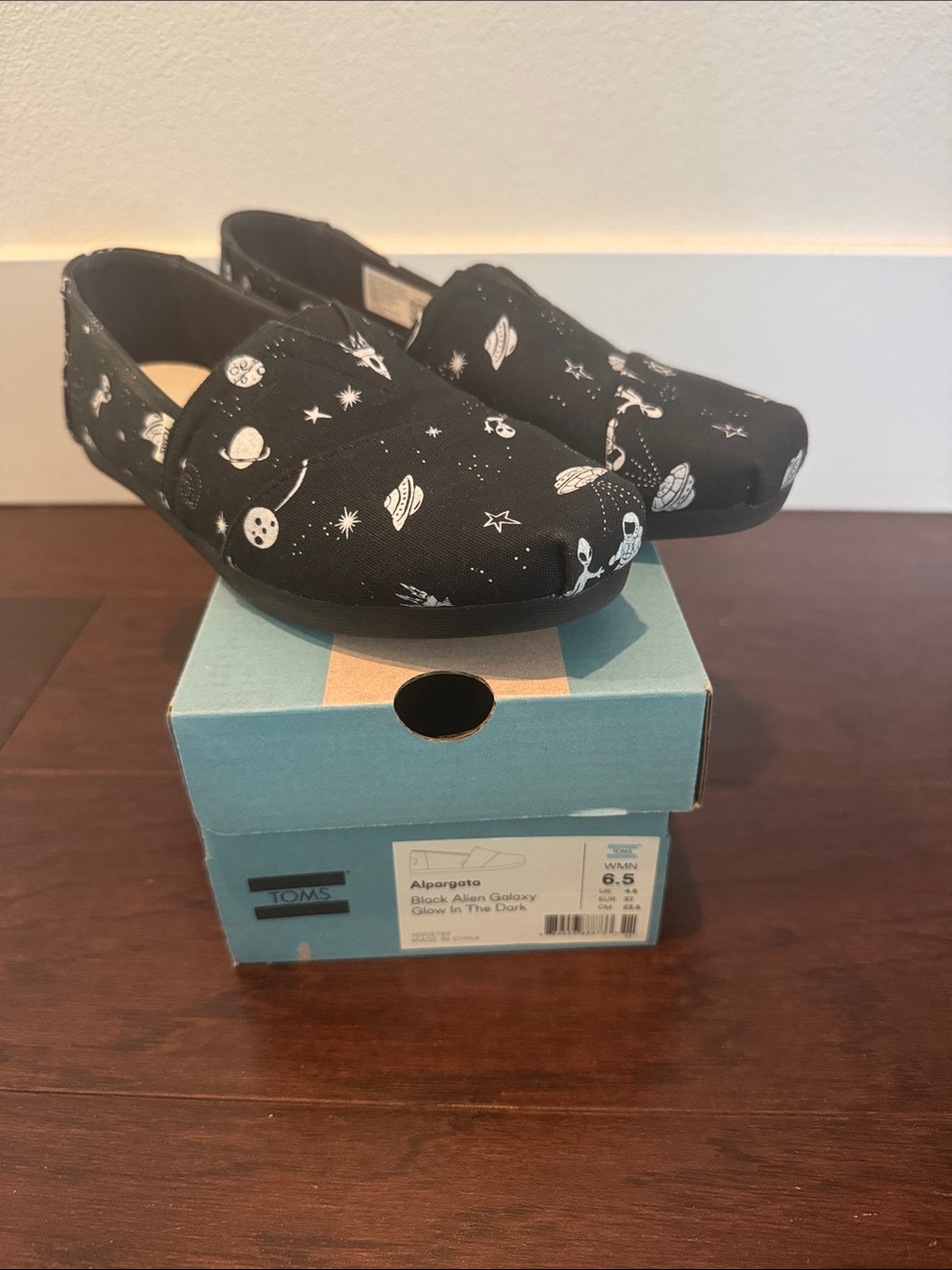 Toms Black Slip-On Moccasins with White Space Print